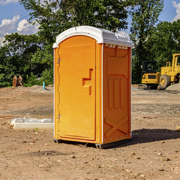 what is the cost difference between standard and deluxe porta potty rentals in Rush City